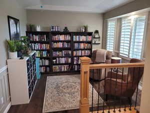 Living area featuring dark wood-style floors