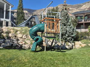 View of playground featuring a mountain view