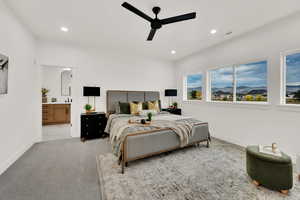 Bedroom with recessed lighting, a ceiling fan, carpet flooring, and ensuite bath