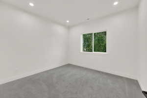 Unfurnished room with recessed lighting and carpet floors