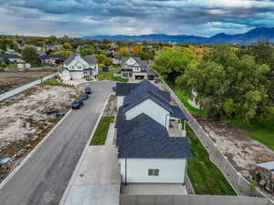 Aerial view of residential area featuring a mountainous background