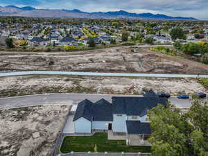 Aerial perspective of suburban area with a mountain backdrop