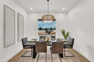 Dining area featuring wood finished floors and recessed lighting