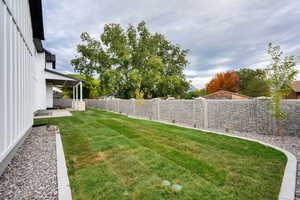 Fenced backyard with a patio area