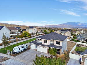 Aerial perspective of suburban area featuring a mountainous background