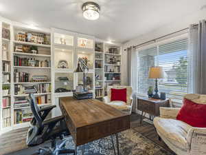 Office space featuring dark wood-style flooring