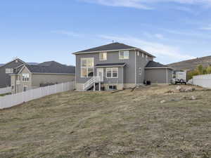 Back of house with stucco siding