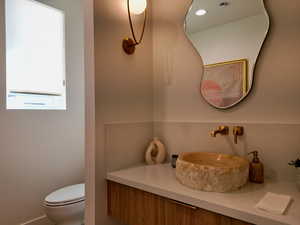 Bathroom with vanity and recessed lighting