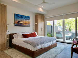 Bedroom featuring wood finished floors, access to outside, recessed lighting, and a ceiling fan