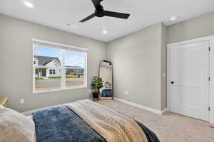 Bedroom featuring carpet, ceiling fan, and recessed lighting