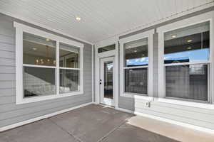 Property entrance featuring a patio