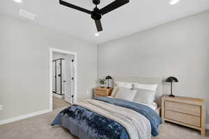 Carpeted bedroom with recessed lighting, a ceiling fan, and ensuite bathroom