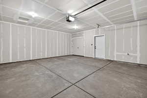 Garage featuring a garage door opener