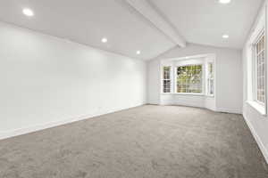 Carpeted empty room with recessed lighting and baseboards