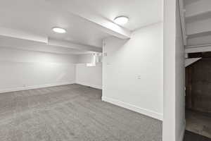 Basement with carpet and baseboards