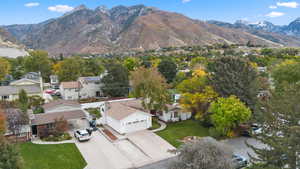 Aerial perspective of suburban area featuring a mountainous background
