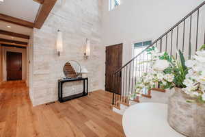 Foyer entrance with stunning accent wall & sconces