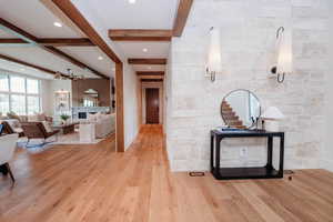 Sneak peak of living room & beams throughout main level