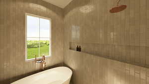 Primary ensuite with freestanding soaker tub and tiled shower