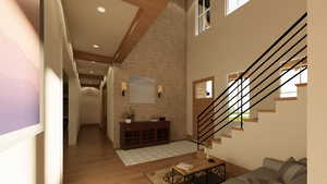 Entry featuring a towering ceiling & modern finishes