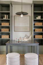 Built-in shelving flanking a recessed alcove with bench seating