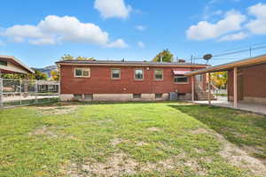 Rear view of property with a patio area