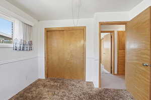 Hallway with carpet floors