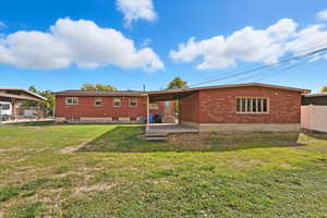 Rear view of house featuring a patio area