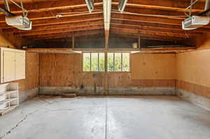 Garage featuring a garage door opener