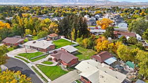 Aerial perspective of suburban area with a mountain backdrop