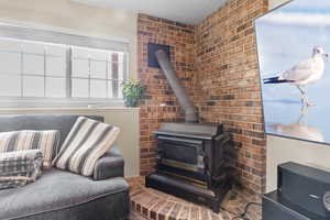 Living area with a wood stove and radiator heating unit