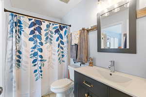 Bathroom with vanity and a shower with curtain
