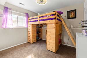 Bedroom with carpet and baseboards