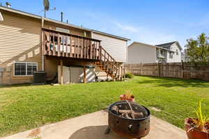 Rear view of house featuring stairs, an outdoor fire pit, and a wooden deck