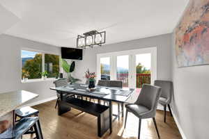 Dining room with dark wood-style floors