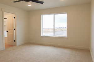 Empty room featuring light carpet, recessed lighting, and ceiling fan