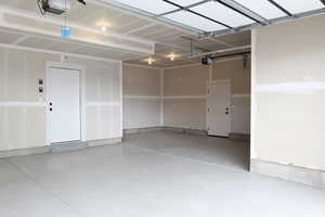 Garage featuring a garage door opener