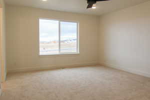 Unfurnished room with light carpet, a ceiling fan, and recessed lighting
