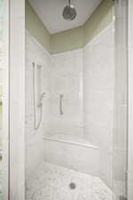 Full bathroom featuring a marble finish shower
