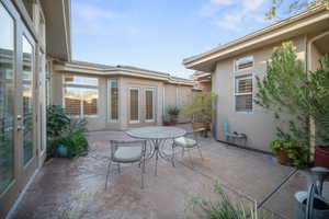 View of patio with french doors and outdoor dining space
