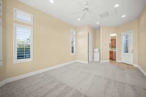Unfurnished bedroom with light colored carpet, recessed lighting, a ceiling fan, and connected bathroom