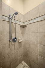 Bathroom featuring a tile shower