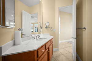 Bathroom with vanity and light tile patterned flooring