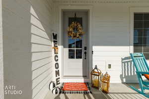 Property entrance with a porch