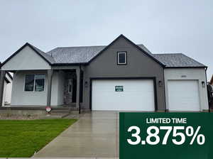 View of front of home featuring a shingled roof, concrete driveway, a porch, a front yard, and stucco siding