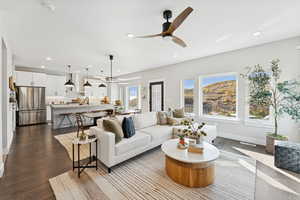 Living area featuring recessed lighting, ceiling fan, and dark wood-style floors
