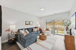 Living room with wood finished floors and baseboards