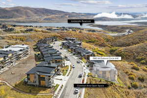 Aerial perspective of suburban area featuring a water and mountain view