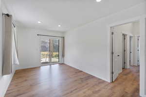 Spare room with recessed lighting and light wood-style flooring