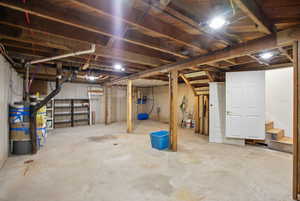 Unfinished basement featuring stairs